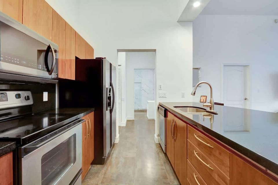 Fully equipped kitchen with complete set of cookware.