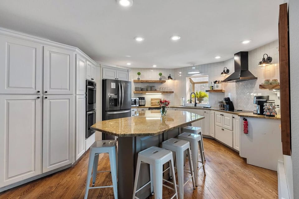 The gourmet kitchen is stocked with cookware, bakeware, great appliances, spices, and kitchen gadgets. It also has seating for six or more.