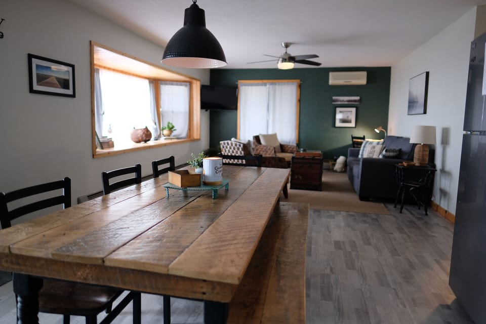 Step into a breathtaking open-concept kitchen, dining, and living area.