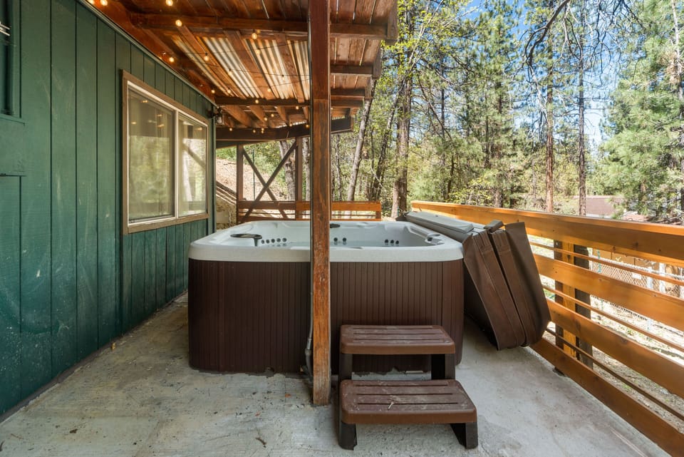 The outdoor hot tub on the bottom floor deck creates a refreshing ambiance 