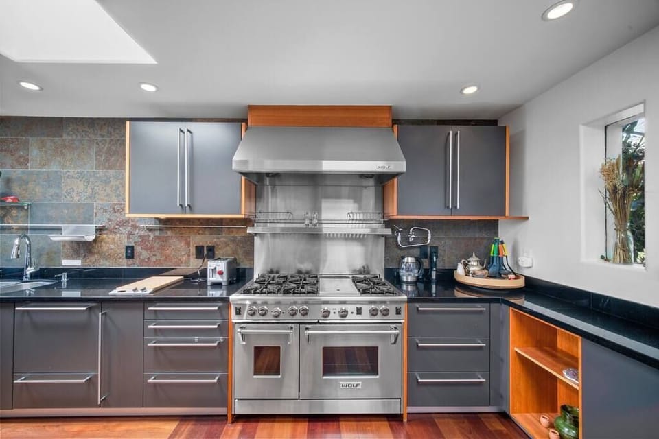 Chef's Kitchen- Wolf 6-burner gas stove and oven, and Bulthaup cabinetry design