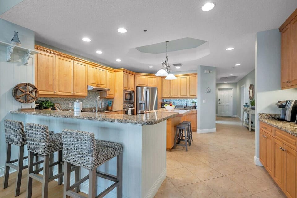 Another view of the well-equipped kitchen offering plenty of counter space & storage.