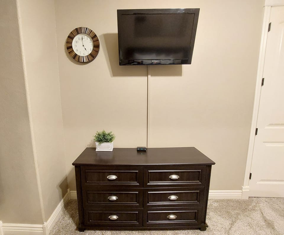 Spare Bedroom's Mounted TV and dresser directly across from the bed!