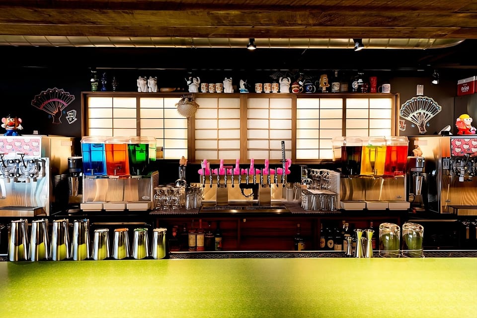 Sip crafted drinks at the colorful bar after exploring.