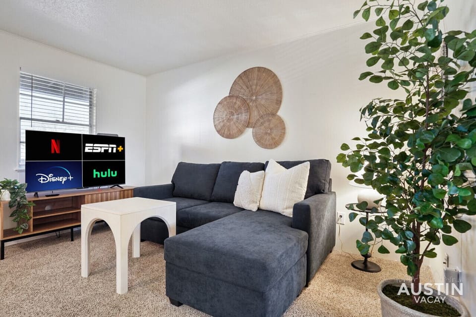 Open living room with smart tv and memory foam sleeper sofa