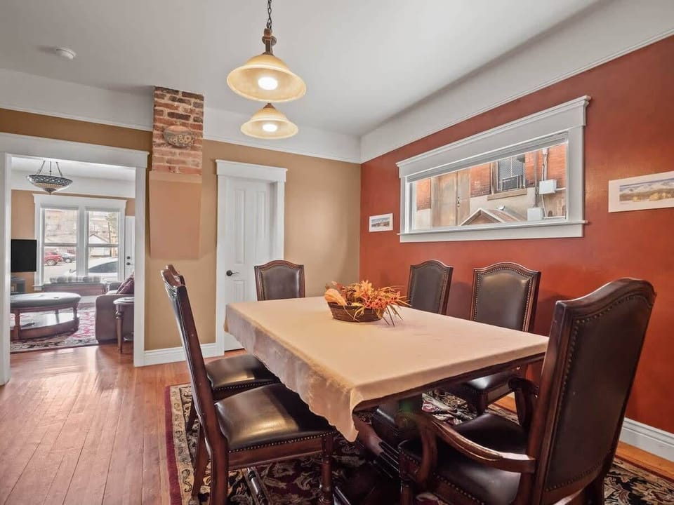 【Dining — Third Angle】 Table-for-eight — runs both family meals and evening games.