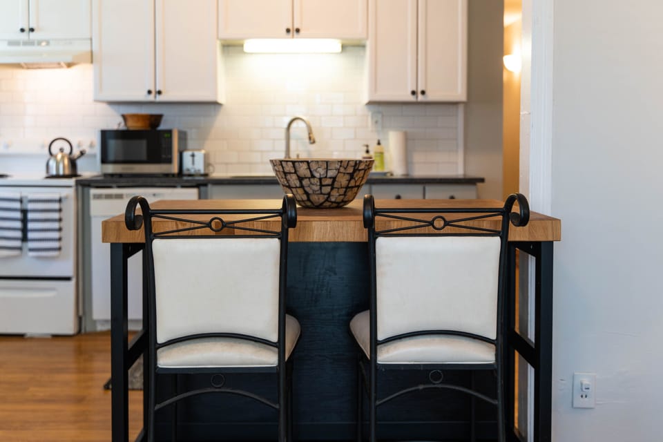 Kitchen island is perfect for watching the cook prepare something delightful