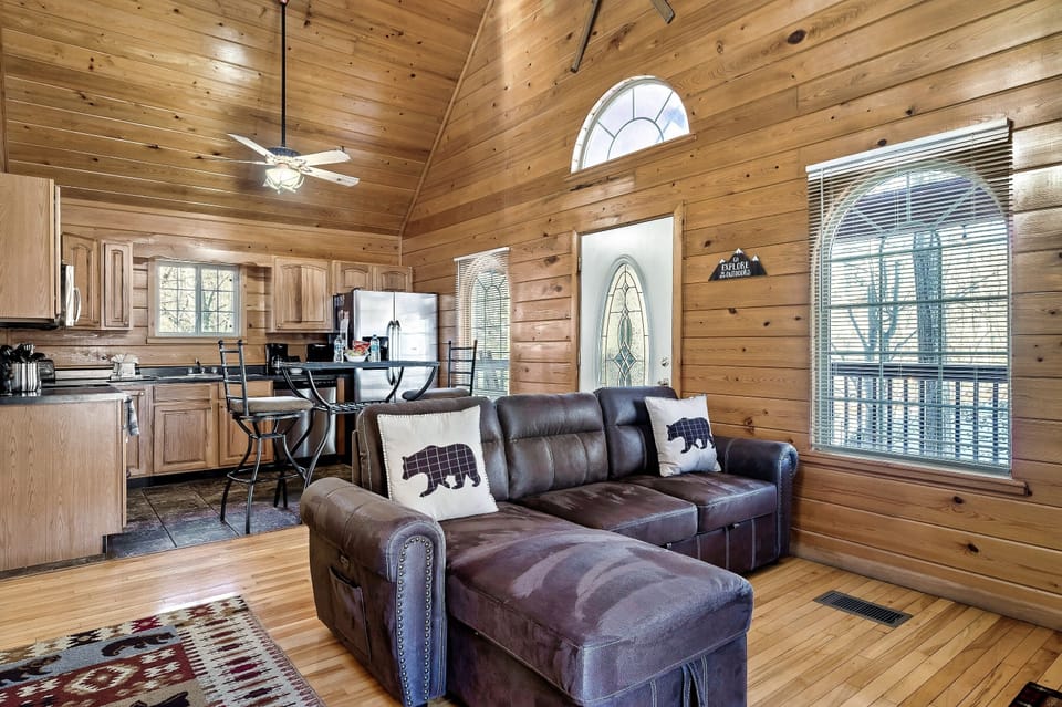 Living room and kitchen with lofted ceilings 