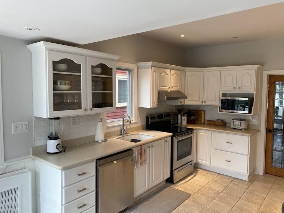 Kitchen includes S/S appliances and everything you need to set a table! 