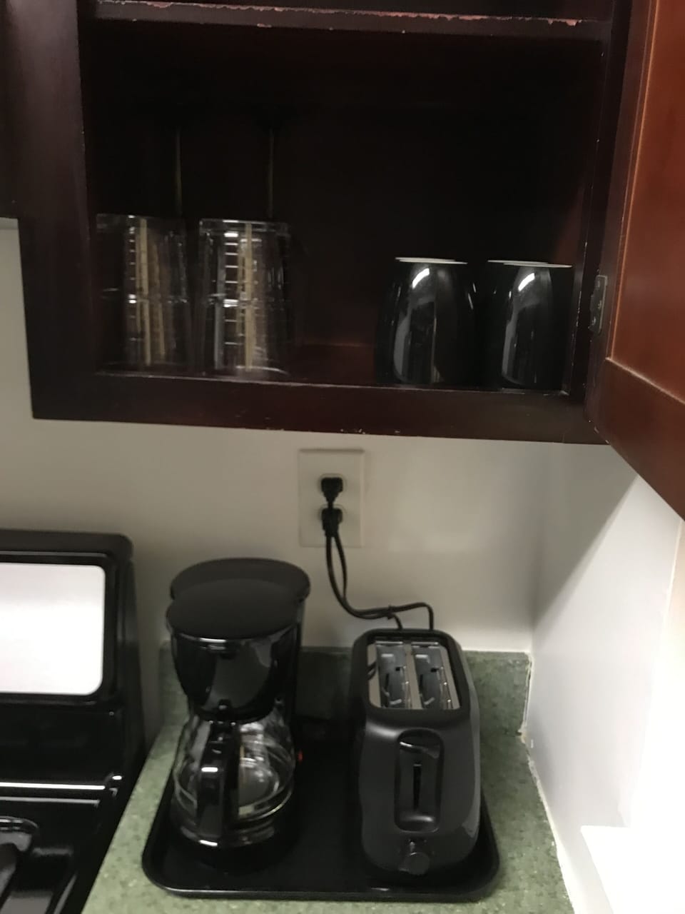 Coffee maker & toaster station. Krystal cup glasses, wine glasses & coffee mugs.