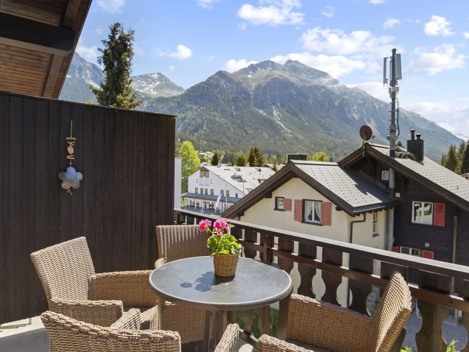 Sky, Cloud, Table, Furniture, Property, Building, Mountain, Chair, Flower, Tree