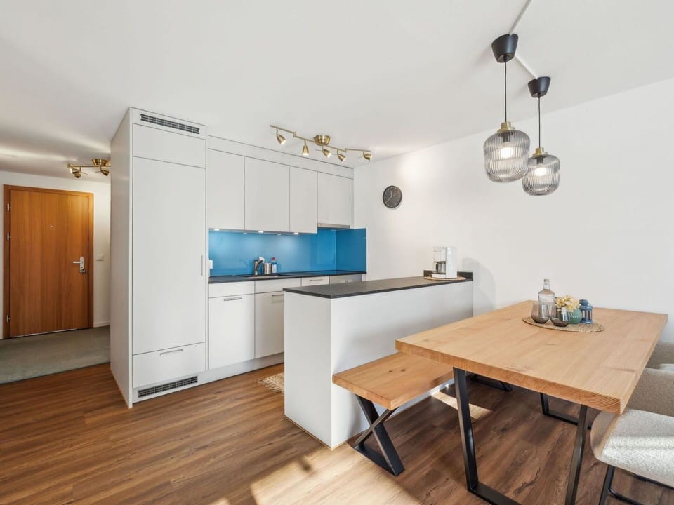 Furniture, Interior Design, Flooring, Kitchen, Floor, Countertop, Wood, Ceiling, Room, Cabinetry