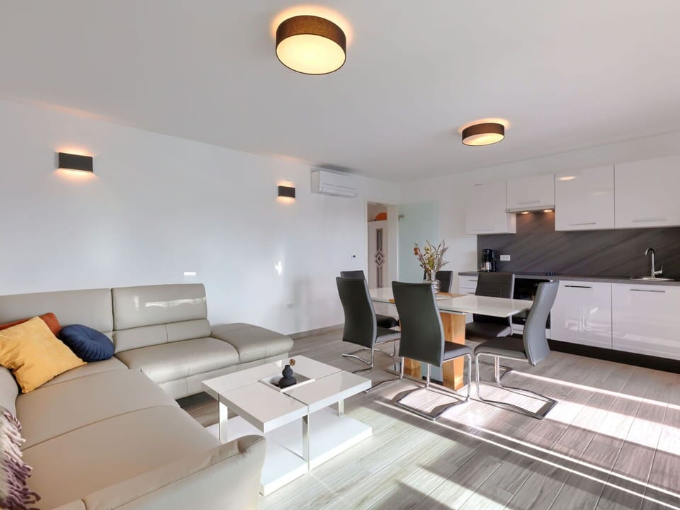 Couch, Property, Furniture, Table, Comfort, Television, Living Room, Lighting, Interior Design, Studio Couch