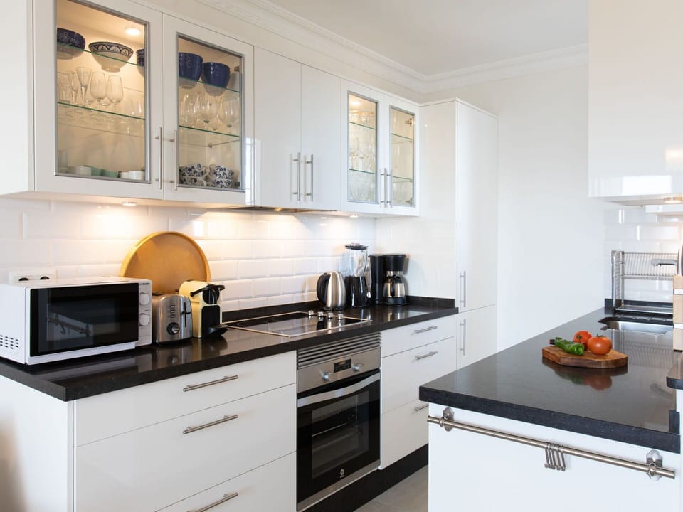 Cabinetry, Countertop, Kitchen Stove, Kitchen, Kitchen Appliance, Home Appliance, Drawer, Cooktop, Floor, Interior Design