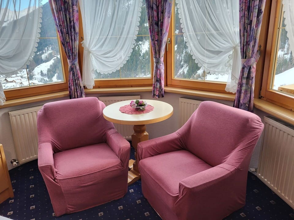 Furniture, Property, Purple, Comfort, Window, Table, Textile, Wood, Curtain, Chair