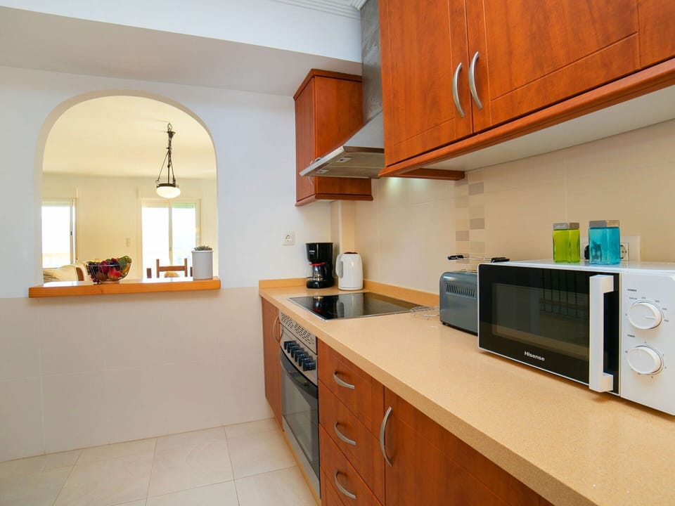 Cloud, Sky, Water, Outdoor Furniture, Shade, Table, Outdoor Table, Chair, Condominium, Porch