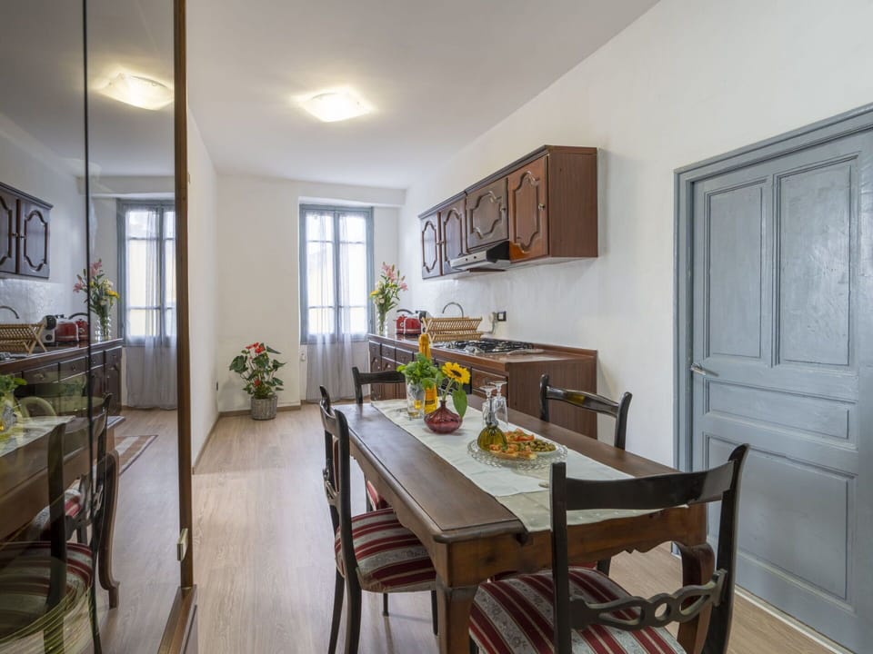 Furniture, Table, Cabinetry, Countertop, Plant, Chair, Kitchen, Flower, Window, Wood