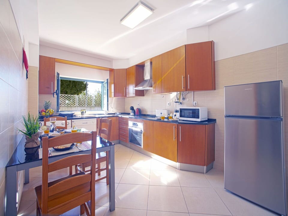 Furniture, Table, Countertop, Cabinetry, Kitchen, Interior Design, Floor, Flooring, Chair, House