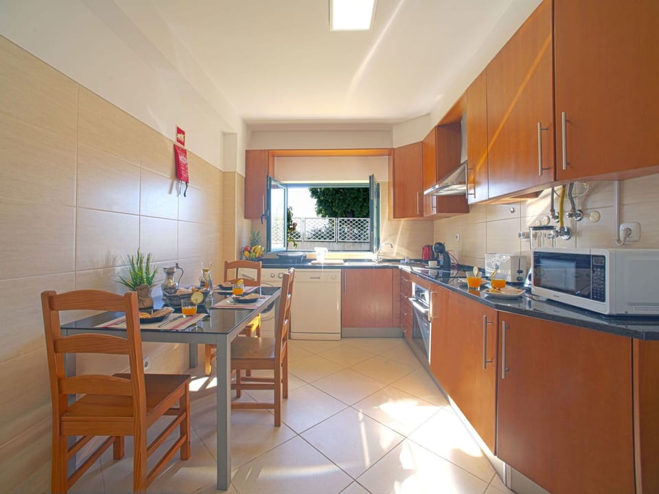 Furniture, Table, Countertop, Cabinetry, Kitchen, Interior Design, Floor, Flooring, Chair, House