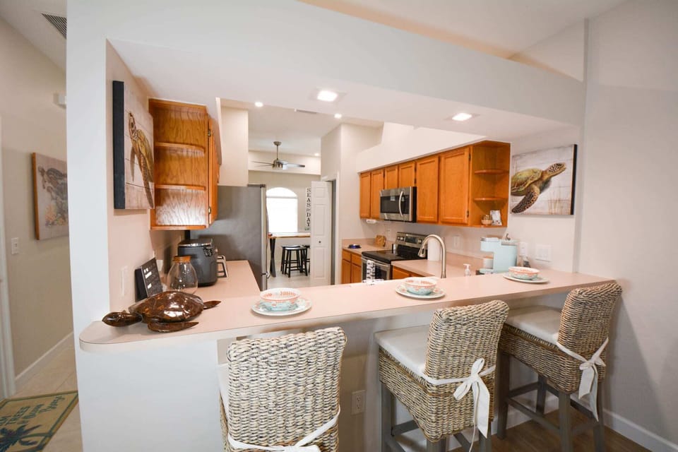 Bar/breakfast counter into kitchen.