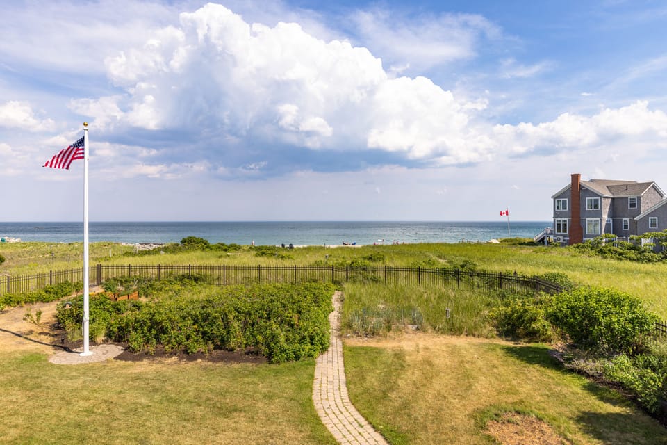 enclosed yard, property extends past fence to high tide line.