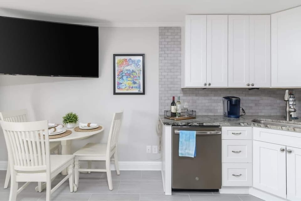 A breakfast nook and an integrated workstation, perfect for remote work.