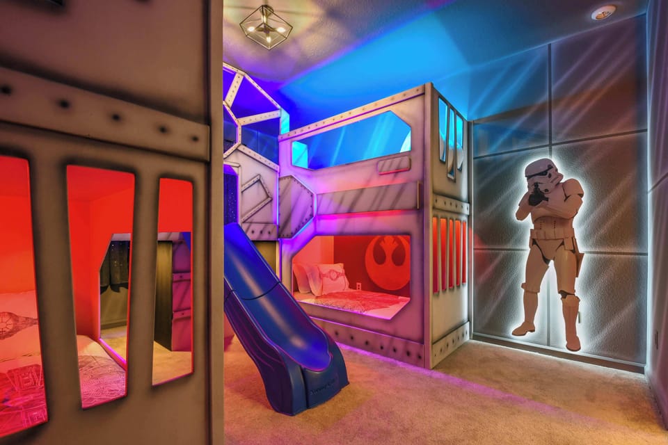 Experience an intergalactic adventure in this Star Wars-themed room featuring bunk beds with a slide and life-sized Stormtroopers.