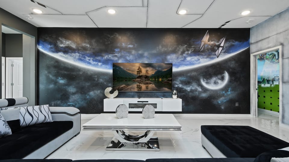 Sleek space-themed living room with galactic mural and modern decor touches.
