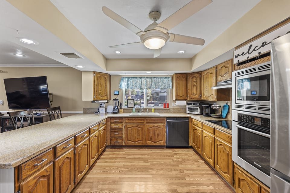 Spacious kitchen has new appliances and a large island for prep / breakfast