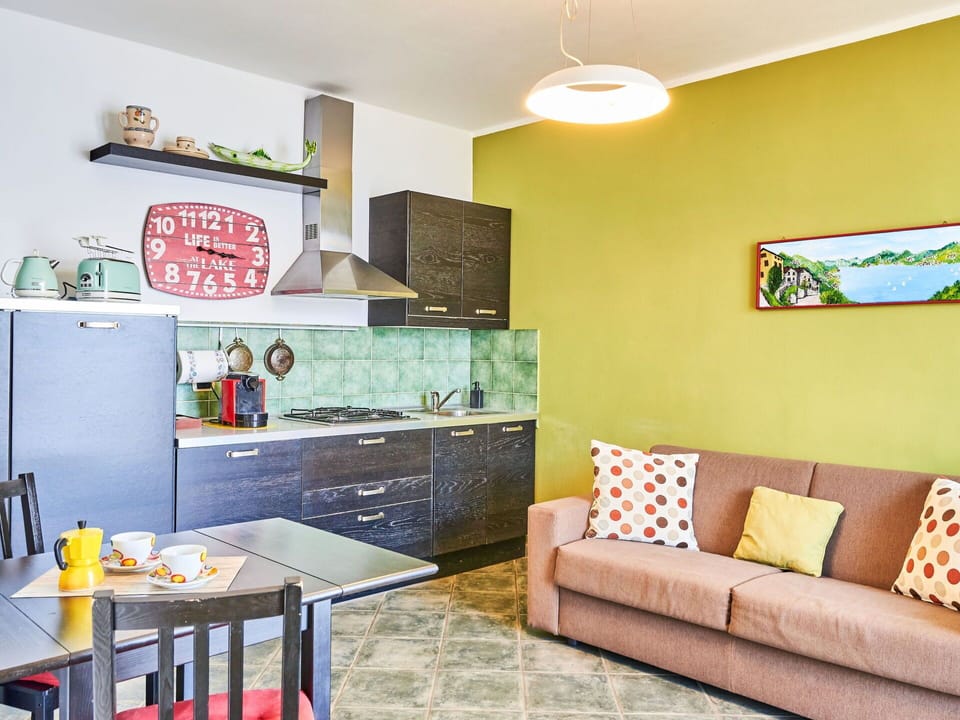 Furniture, Property, Table, Green, Building, Couch, Interior Design, Yellow, Floor, Flooring