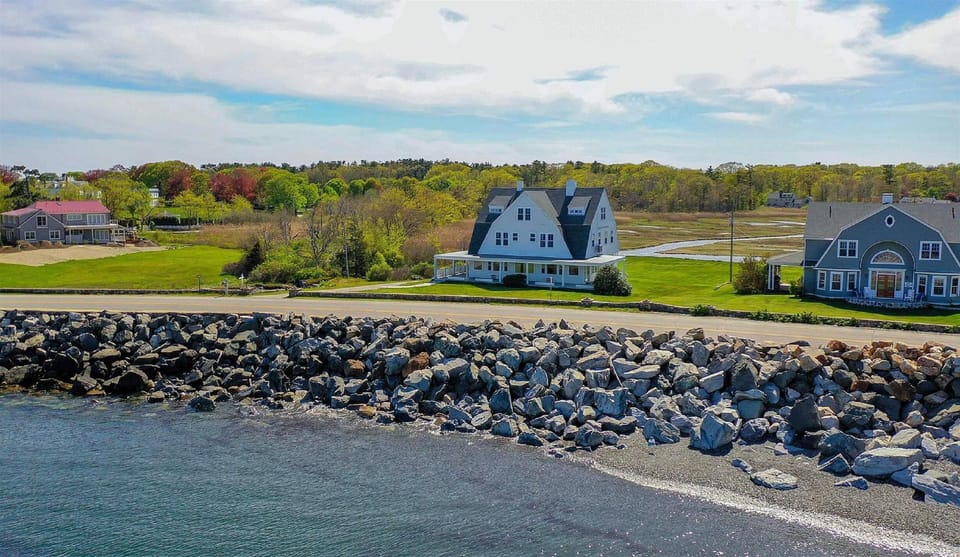 Aerial view - pebble beach across the road, marshland in rear, Chapel Creek left