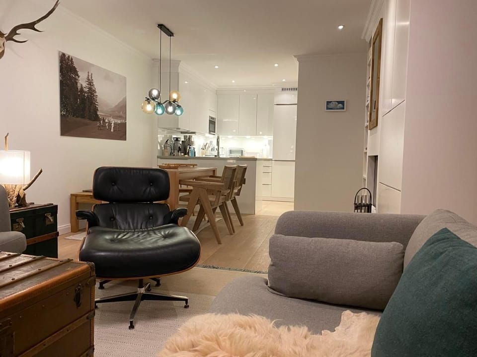 Living area, looking to the kitchen and hallway