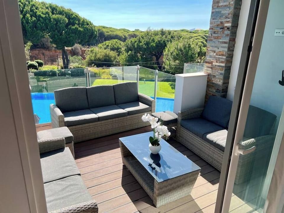 Upstairs balcony with garden furniture