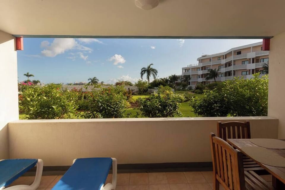 Step onto your private patio and take in panoramic views of the ocean, lush gardens, and incoming planes—truly the best seat in Maho Beach! Enjoy your morning coffee or evening cocktail with a view that never gets old.