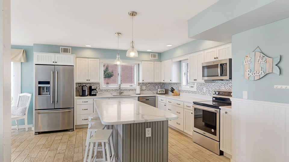 Side view of the kitchen with seating on the island.