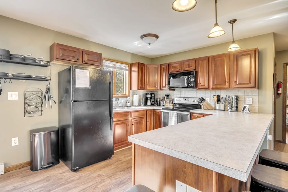 Fully equipped kitchen with refrigerator, stove, Ninja coffee maker, mixer, etc