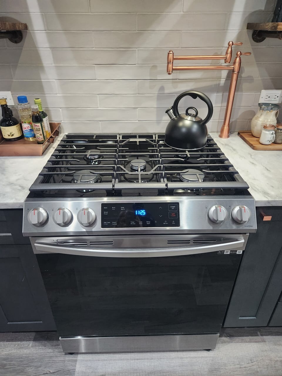 Gas range with pot filler