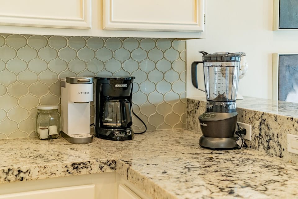 Blender, coffee maker, and Keurig located in the kitchen