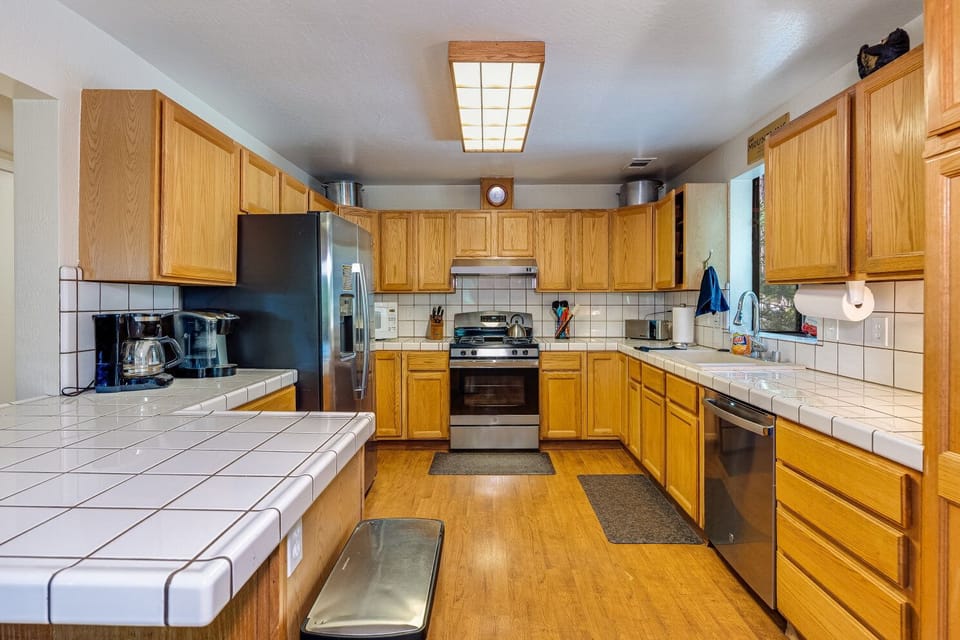 Kitchen-stocked with plenty of dinnerware, pots/pans, bakeware, crockpot,  etc. 