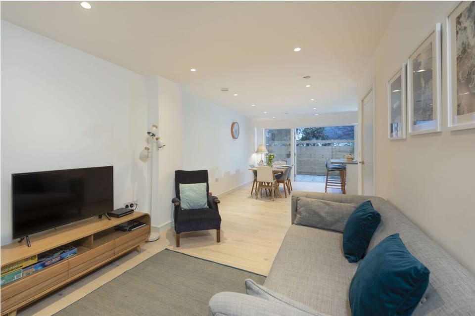 The light airy open plan living space with seating area, smart tv and DVD's