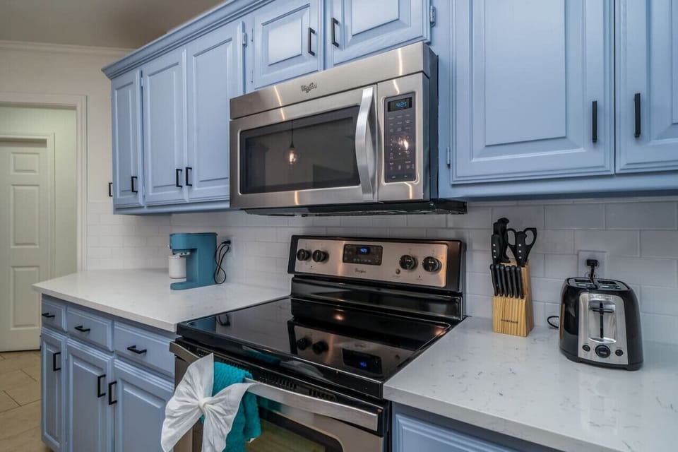 Whip up anything from a quick breakfast to a family dinner with ease. This kitchen features stainless steel appliances, a full knife set, toaster, and coffee maker to start your mornings right. With cooking utensils and starter spices already stocked, you