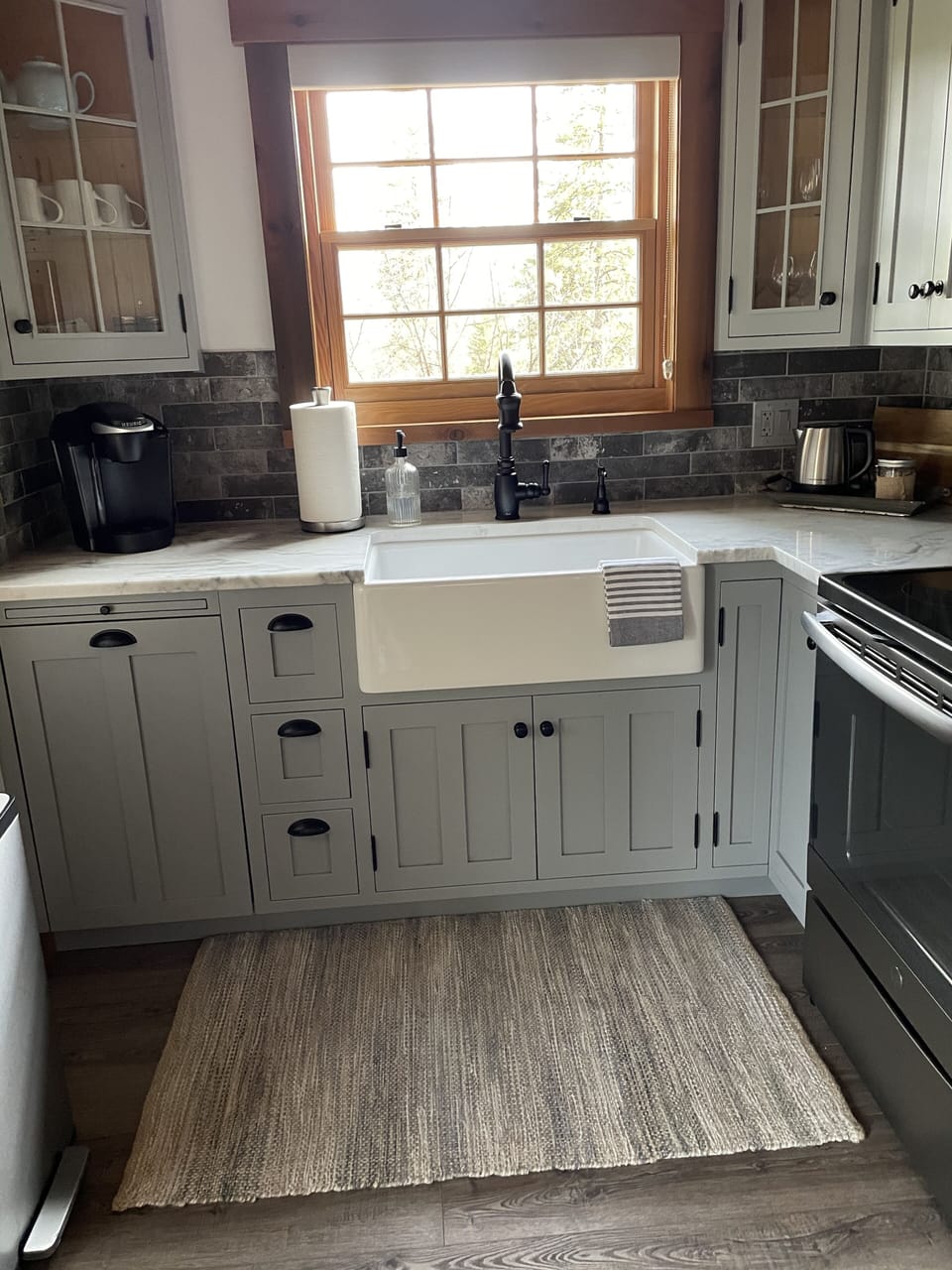 Kitchen is equipped with appliances such as Keurig coffee maker & electric pot