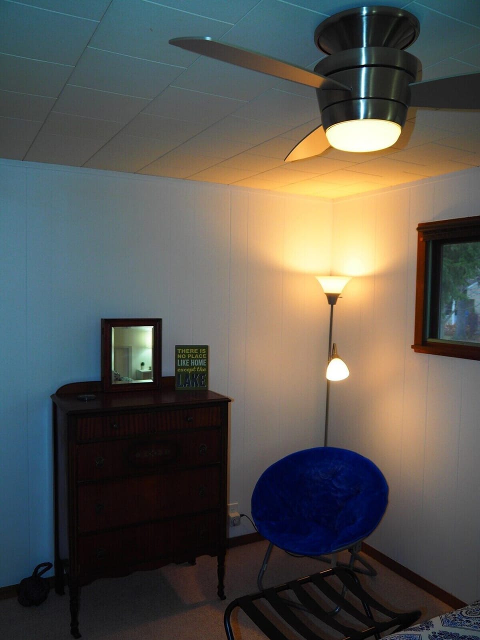 BEDROOM #1:  Features a queen-size bed, nightstands with lamps, ceiling fan, chair, dresser, closet, and full-length mirror.