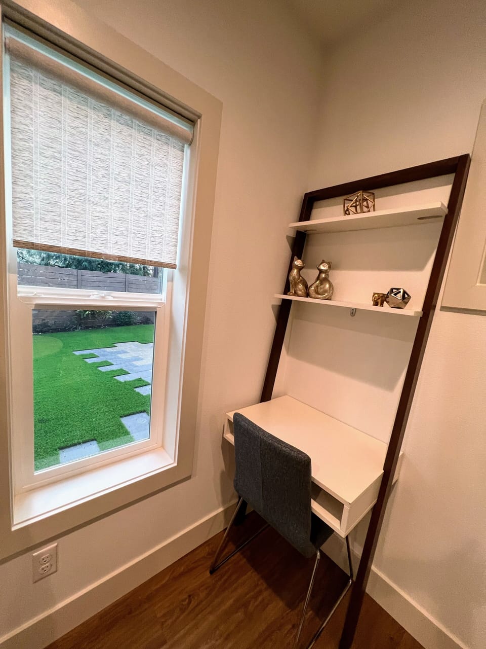 Dedicated work bench in the living room overlooking the yard 