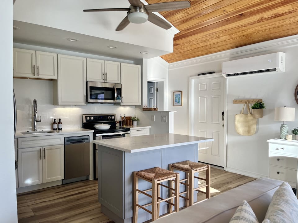 Spacious open well equipped kitchen with island seating. 