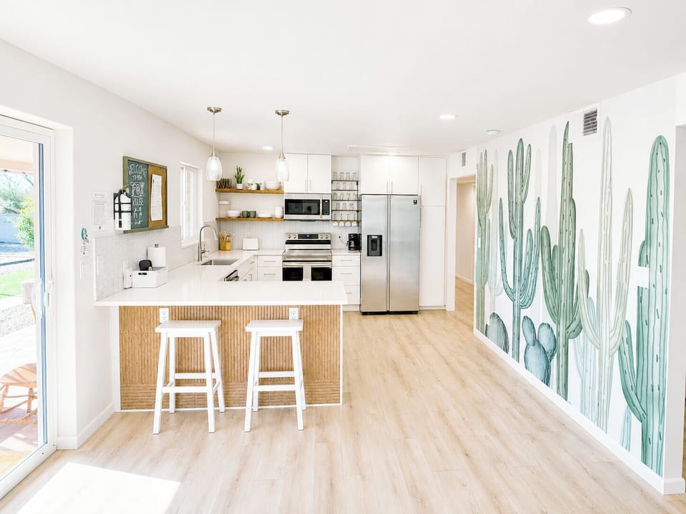 Nicely stocked kitchen- stainless steel appliances and plenty of counter space.