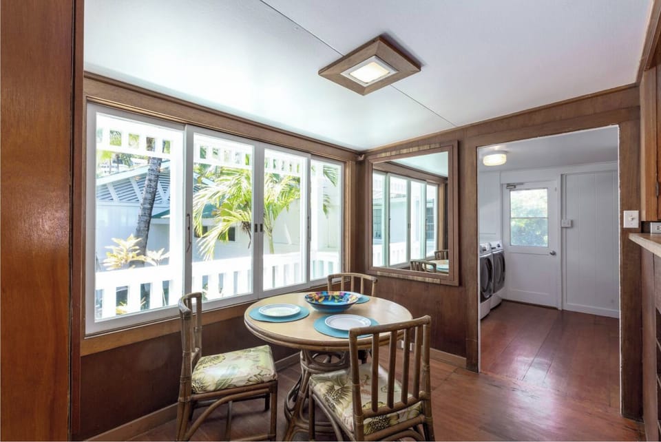 Kitchen with two large refrigerators, breakfast table. 