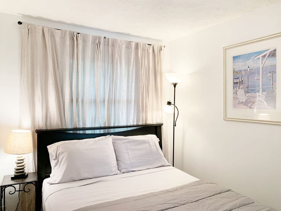 Queen bedroom is cozy and offers plenty of storage