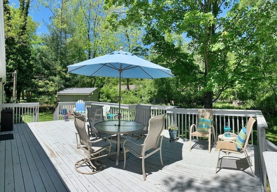Lovely deck with outdoor furniture overlooking the backyard
