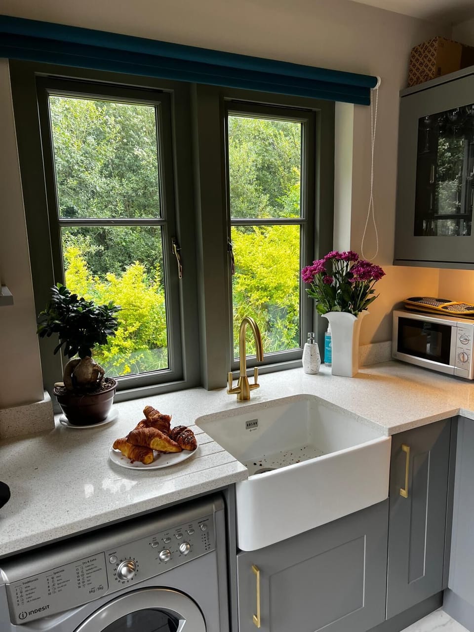 Kitchen looking out to beautiful woodland.